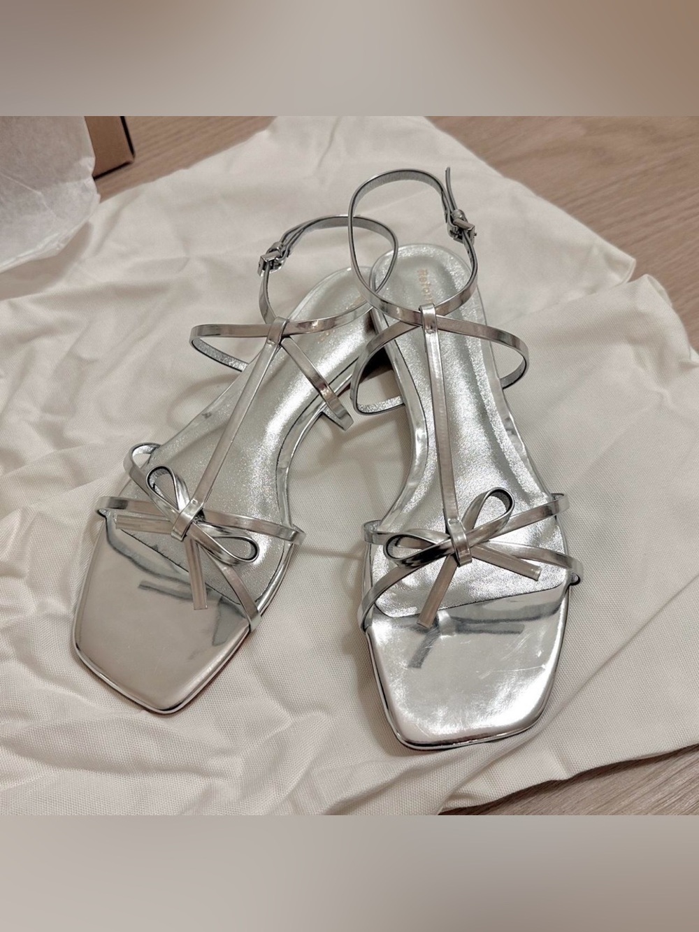 Reformation Silver Metallic Bow Strappy Sandals